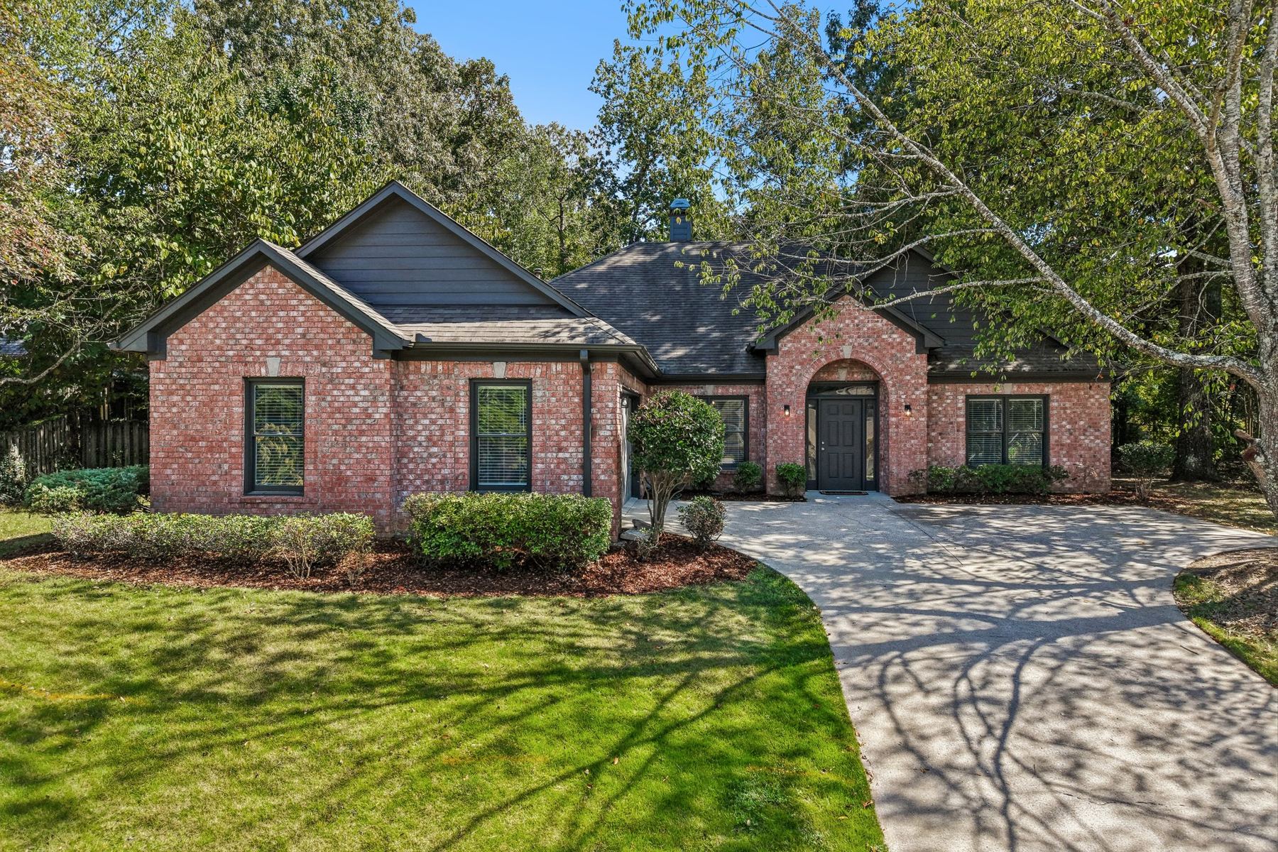 Front of 304 Eaton Circle, a brick home with an arched entry